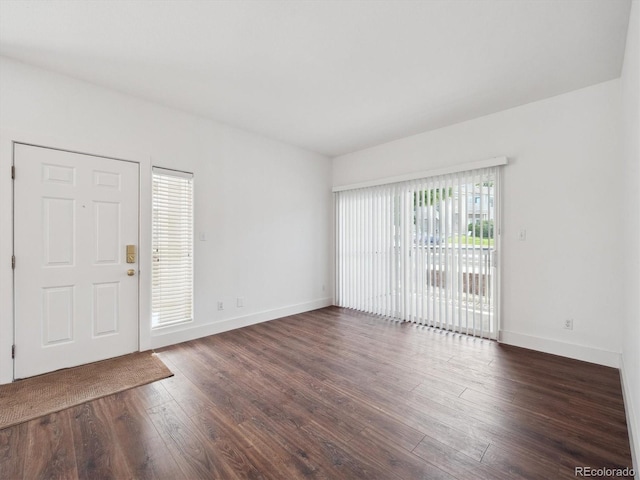 3855 Canyon Ranch Rd Unit 104, Highlands Ranch, CO 80126 - foyer featuring dark wood-style flooring and baseboards