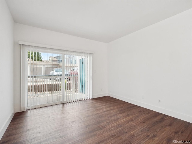 3855 Canyon Ranch Rd Unit 104, Highlands Ranch, CO 80126 - empty room featuring dark wood finished floors and baseboards
