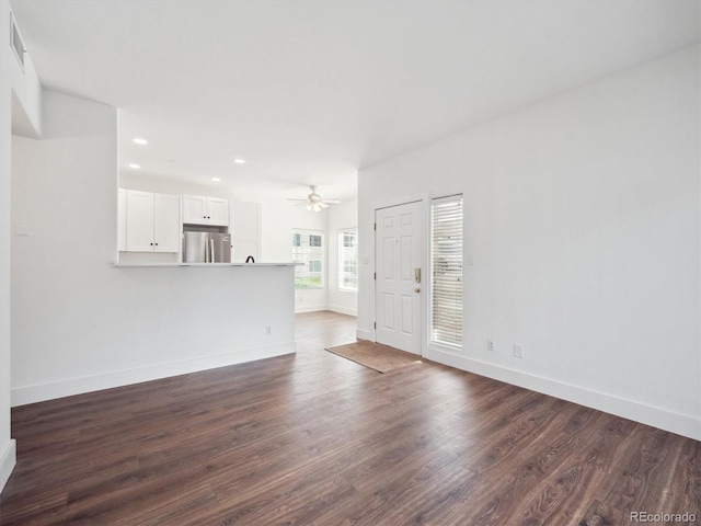 3855 Canyon Ranch Rd Unit 104, Highlands Ranch, CO 80126 - unfurnished living room featuring baseboards, dark wood finished floors, ceiling fan, and recessed lighting