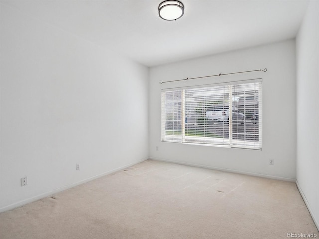 3855 Canyon Ranch Rd Unit 104, Highlands Ranch, CO 80126 - spare room with light carpet and baseboards