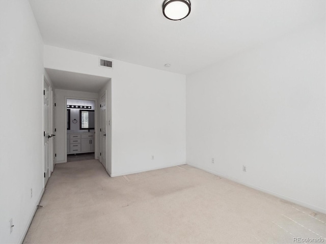 3855 Canyon Ranch Rd Unit 104, Highlands Ranch, CO 80126 - spare room featuring light carpet and baseboards