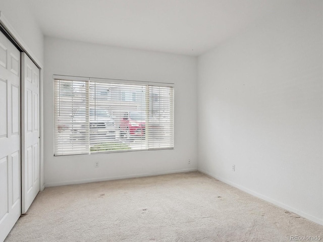 3855 Canyon Ranch Rd Unit 104, Highlands Ranch, CO 80126 - unfurnished bedroom with carpet, a closet, and baseboards