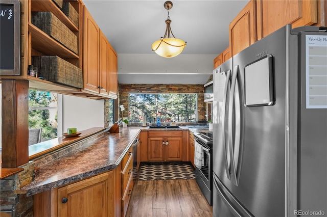 kitchen with a sink, stainless steel appliances, plenty of natural light, and open shelves