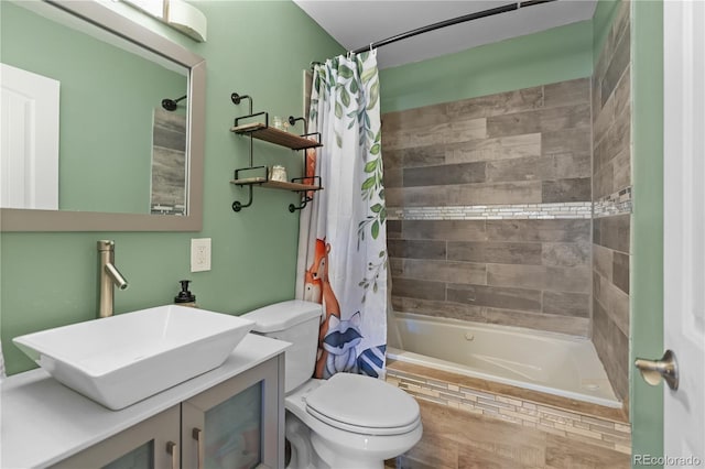 bathroom with vanity, toilet, and shower / bath combo with shower curtain