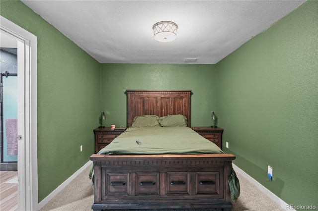 bedroom featuring carpet flooring, visible vents, and baseboards