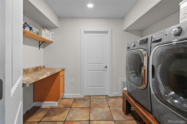 laundry area featuring washer and dryer, recessed lighting, cabinet space, light tile patterned floors, and baseboards