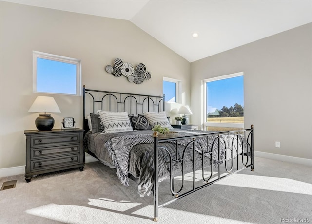 carpeted bedroom featuring lofted ceiling