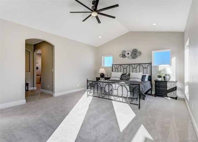 bedroom with light colored carpet, ceiling fan, and lofted ceiling