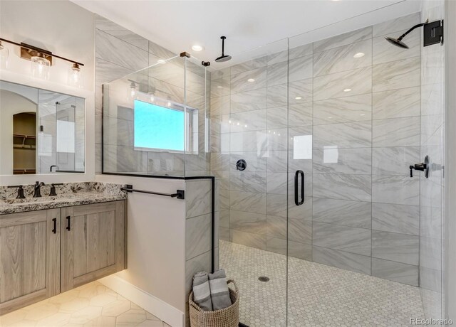 bathroom with vanity, tile patterned floors, and an enclosed shower