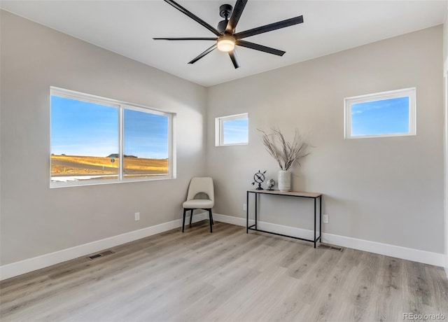 unfurnished room with light hardwood / wood-style floors and ceiling fan