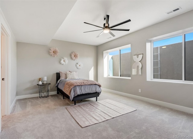 carpeted bedroom with ceiling fan