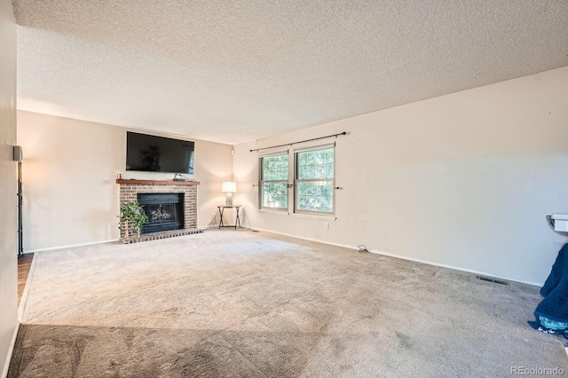 4049 S Nucla Way, Aurora, CO 80013 - unfurnished living room featuring a textured ceiling, a brick fireplace, and carpet flooring