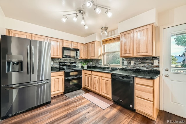 4049 S Nucla Way, Aurora, CO 80013 - kitchen featuring black appliances, light brown cabinetry, dark wood-style floors, and decorative backsplash