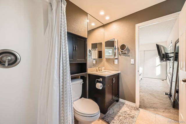 4049 S Nucla Way, Aurora, CO 80013 - bathroom featuring vanity, tile patterned floors, a textured wall, recessed lighting, and curtained shower