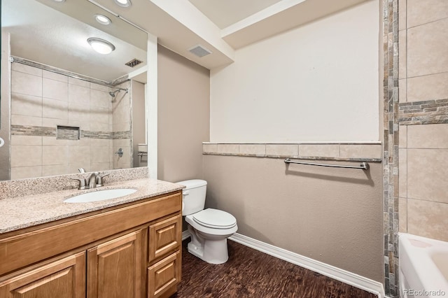 4049 S Nucla Way, Aurora, CO 80013 - bathroom with vanity, wood finished floors, and shower / tub combination