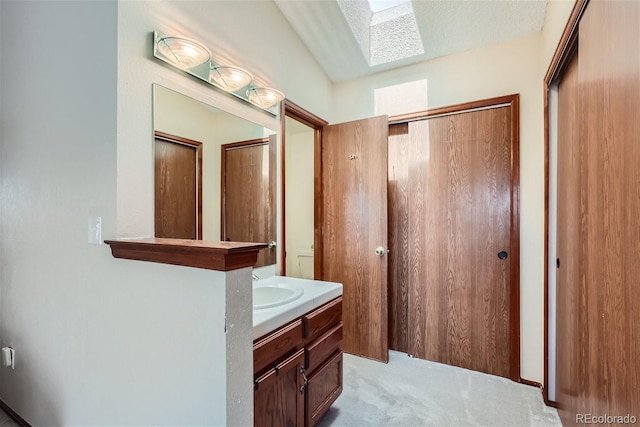 6057 S Pierson St, Littleton, CO 80127 - bathroom featuring vanity and a skylight