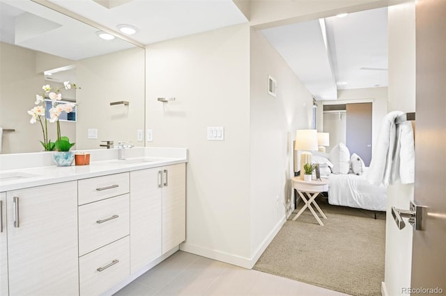 bathroom with tile patterned flooring and vanity