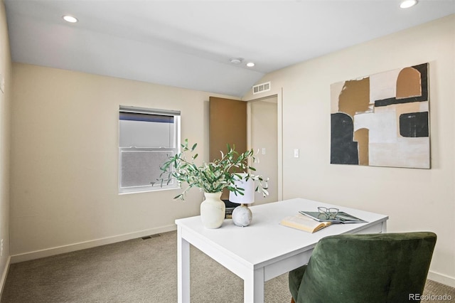 carpeted office space with lofted ceiling