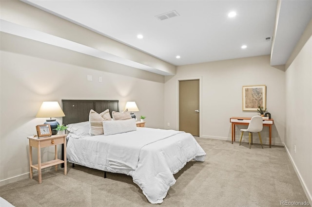 bedroom featuring light carpet