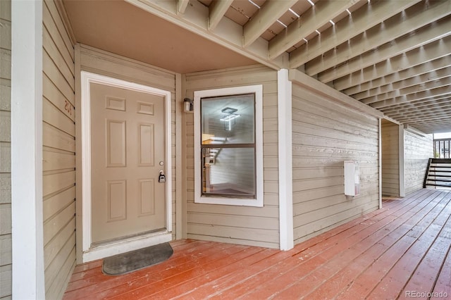 property entrance featuring a deck