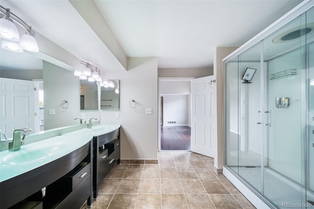 bathroom with vanity, tile patterned floors, and walk in shower