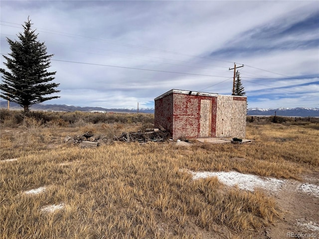 view of outbuilding with a rural view