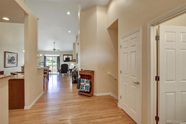 hallway with light hardwood / wood-style flooring