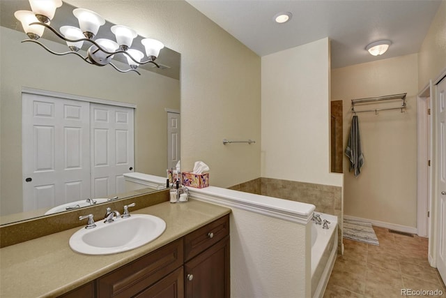 bathroom featuring a closet, visible vents, a notable chandelier, and tile patterned floors