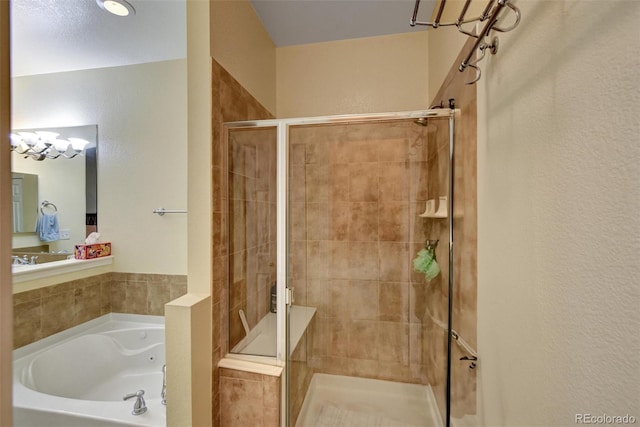 bathroom with a shower stall and a bath