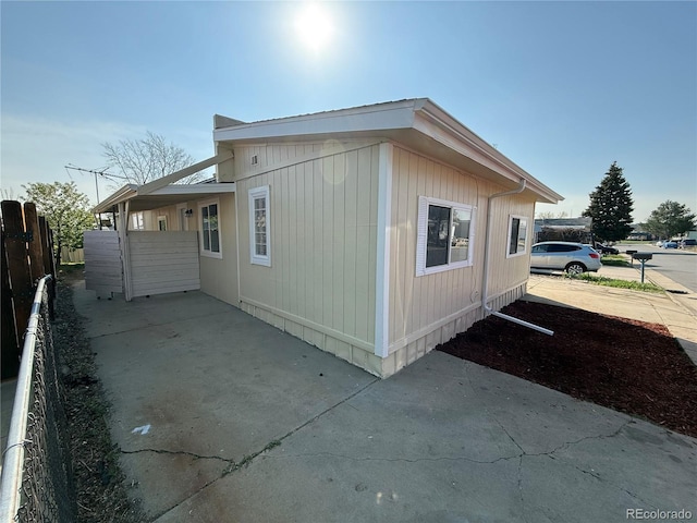 9036 Mandel St, Denver, CO 80260 - view of side of home with fence and a patio
