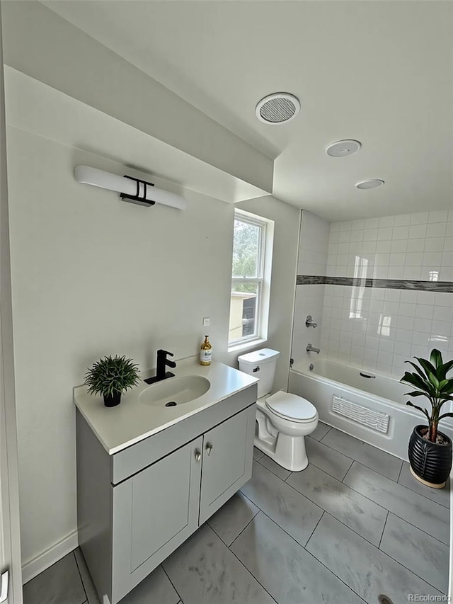 9036 Mandel St, Denver, CO 80260 - full bathroom featuring toilet, vanity, washtub / shower combination, and tile patterned floors