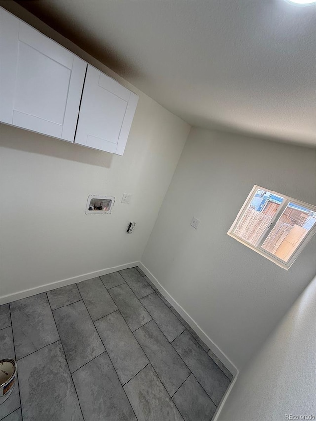 9036 Mandel St, Denver, CO 80260 - laundry area with cabinet space, hookup for a washing machine, and baseboards