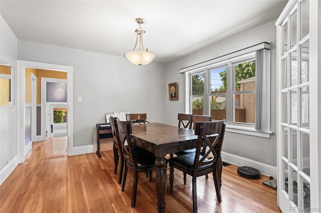 dining space featuring light hardwood / wood-style floors