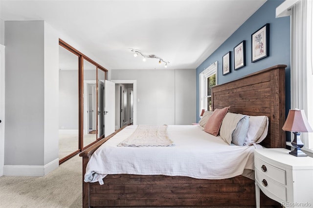 carpeted bedroom with a closet