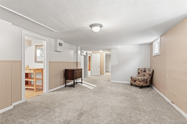 basement featuring light colored carpet