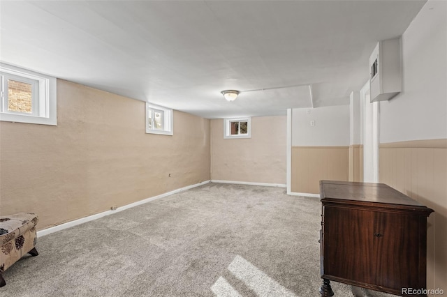 basement with a healthy amount of sunlight and carpet floors