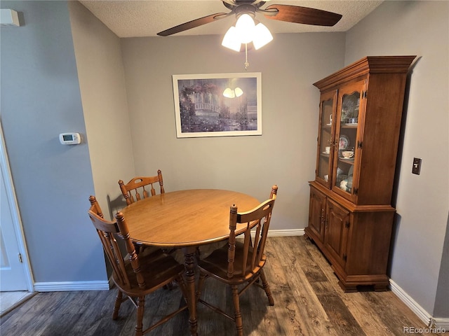 14232 E Hawaii Cir Unit A, Aurora, CO 80012 - dining space with wood finished floors, ceiling fan, and a textured ceiling