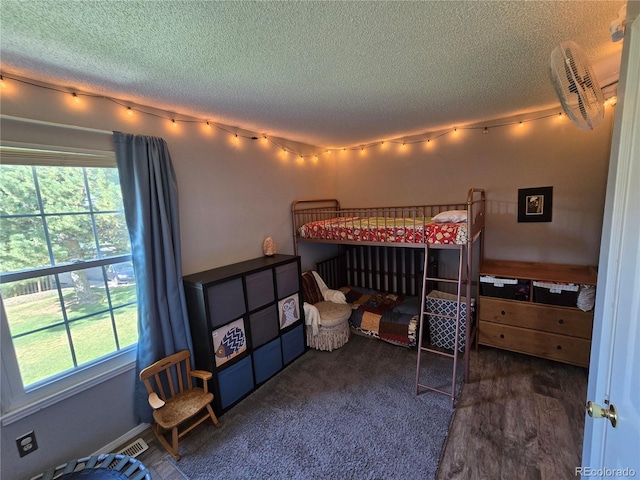 14232 E Hawaii Cir Unit A, Aurora, CO 80012 - bedroom with a textured ceiling and multiple windows