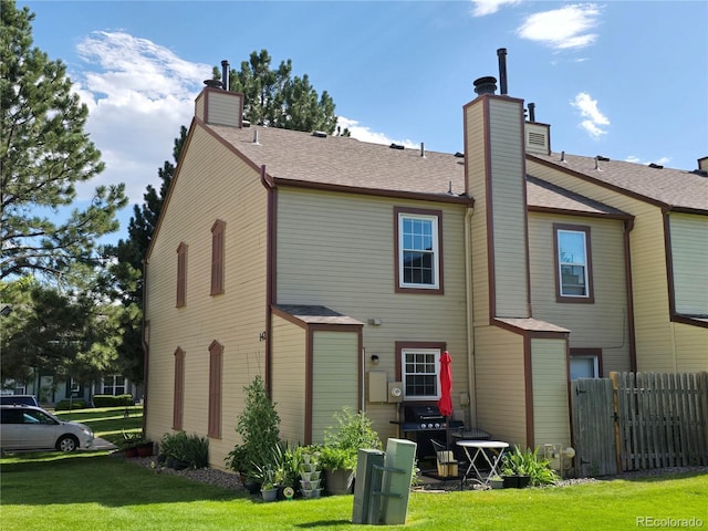 14232 E Hawaii Cir Unit A, Aurora, CO 80012 - back of house with a chimney