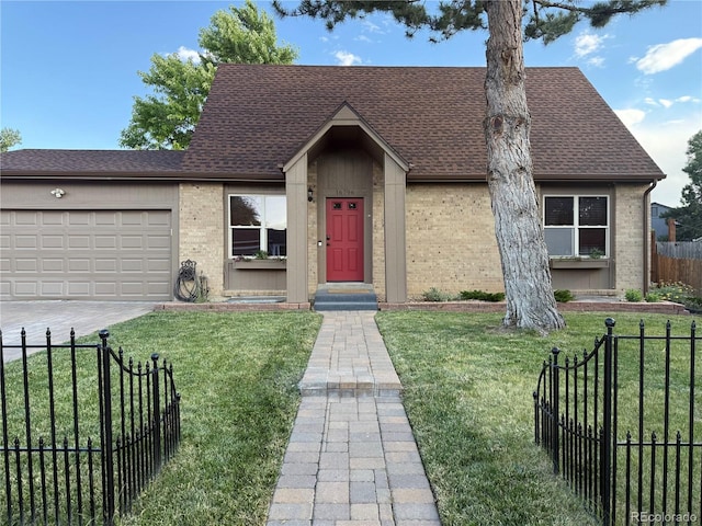 16796 E Union Ave, Aurora, CO 80015 - view of front facade with brick siding, a shingled roof, an attached garage, and driveway