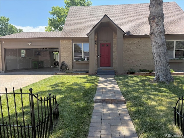16796 E Union Ave, Aurora, CO 80015 - view of front of property with a garage, brick siding, a shingled roof, and driveway