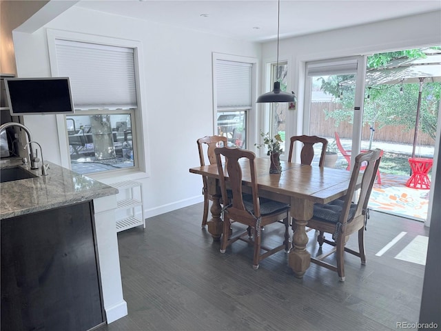 16796 E Union Ave, Aurora, CO 80015 - dining space with baseboards and dark wood-style floors