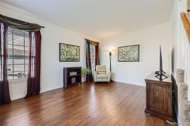 living area with dark wood finished floors and baseboards