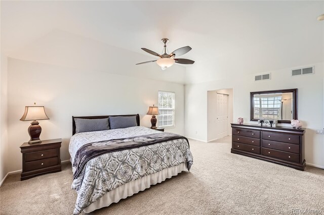 carpeted bedroom featuring baseboards, visible vents, and a ceiling fan