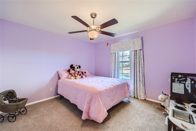 bedroom featuring carpet floors, ceiling fan, and baseboards