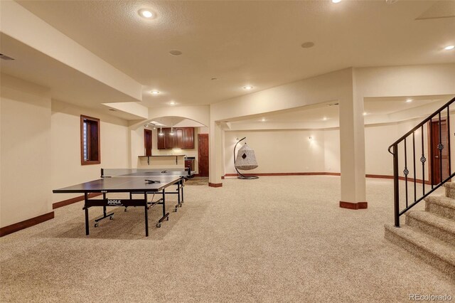 playroom featuring baseboards, carpet flooring, recessed lighting, and arched walkways