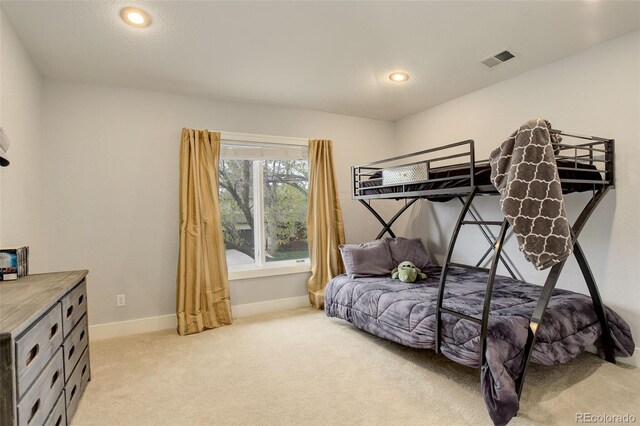 bedroom featuring recessed lighting, baseboards, visible vents, and light carpet