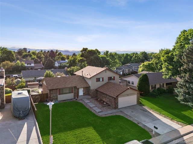 7351 S Marion St, Centennial, CO 80122 - view of front facade featuring a residential view, concrete driveway, stone siding, an attached garage, and brick siding