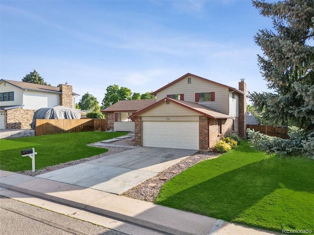 7351 S Marion St, Centennial, CO 80122 - view of front of house with brick siding, an attached garage, concrete driveway, and a chimney