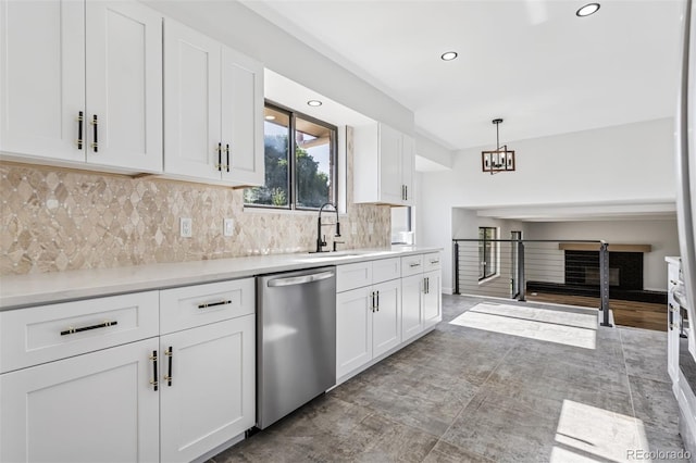 7351 S Marion St, Centennial, CO 80122 - kitchen with stainless steel dishwasher, white cabinets, decorative backsplash, and recessed lighting